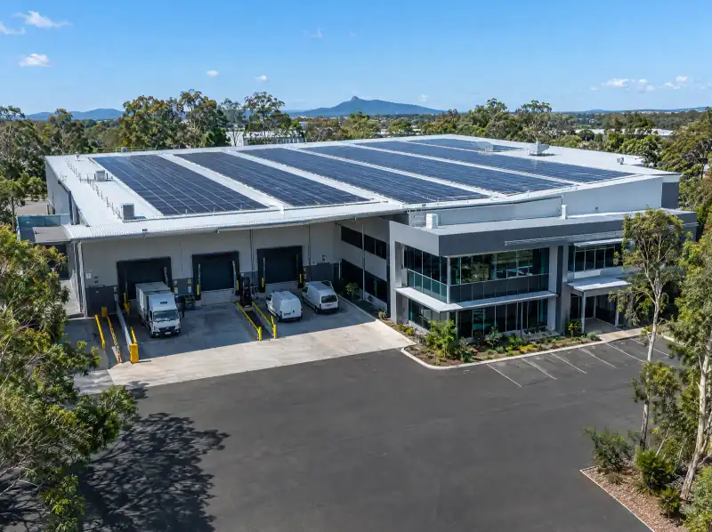 Business warehouse roof covered in solar panels